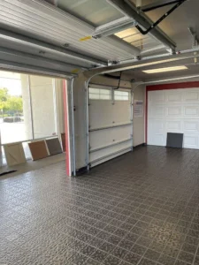 Variety of garage doors including sectional, roll-up, and swing-out styles, showcasing options for installation